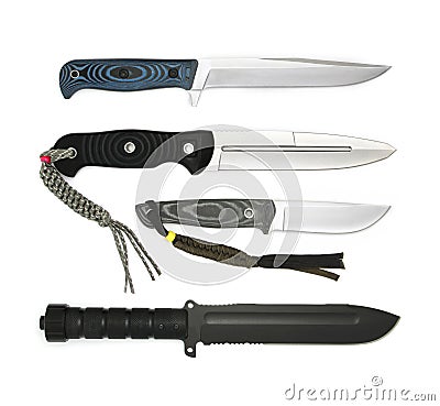 Collection four Tactical knives different sizes isolated on white. One knife with black anti-reflective blade coating Stock Photo