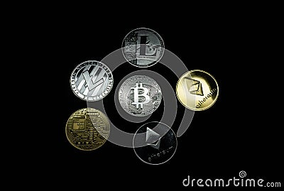 A collection of gold and silver cryptocurrency coins Editorial Stock Photo