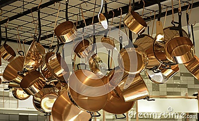 Collection hanging copper-colored pans Stock Photo