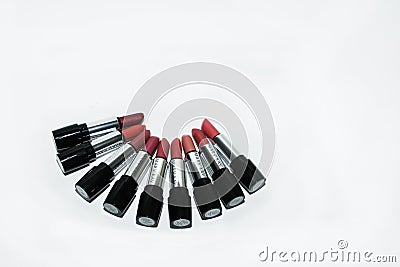 A collection of Mary Kay lipsticks in different shades lying open on a white background close up Editorial Stock Photo