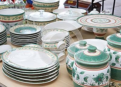 Collection of matching dishes for sale at a garage sale Stock Photo