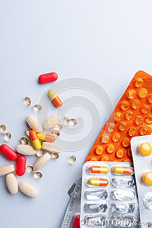 Full of pills and capsules scattered on a white background Stock Photo