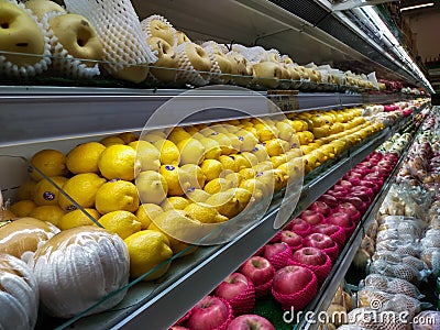 collection of multiple fruits such as local orange and multiple kind of apple in the market showcase Stock Photo