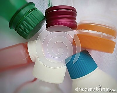 A collection of plastic bottles and caps with various shapes and colors Stock Photo