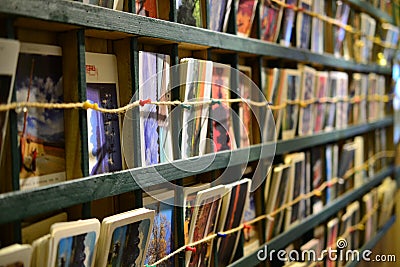 Collection of Postcards and Photos in a cafe in Yangshuo, Guangxi, China Editorial Stock Photo