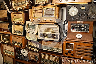 Collection of retro radio and telephone receivers circa 1950. Listening to music. Vintage instagram old style filtered Editorial Stock Photo