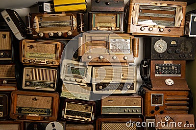 Collection of retro radio and telephone receivers circa 1950. Listening to music. Vintage instagram old style filtered Editorial Stock Photo