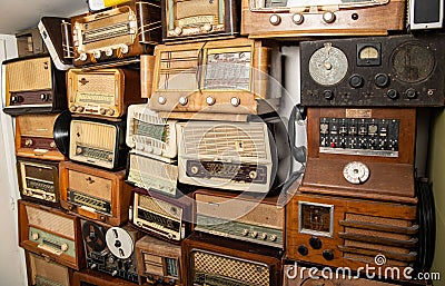 Collection of retro radio and telephone receivers circa 1950. Listening to music. Vintage instagram old style filtered Editorial Stock Photo