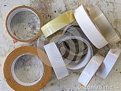 A pile of rolls of tapes on a table Stock Photo