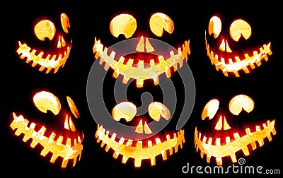 Collection of scary Halloween carved pumpkin Jack o lantern faces glowing red and yellow eerily on black Stock Photo