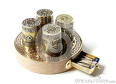 Collection set ot four thimbles on base with box for needles. Thimbles with etching with Greek aphorisms. Stock Photo