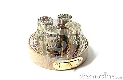 Collection set ot four thimbles on base with box for needles. Thimbles with etching with Greek aphorisms. Stock Photo