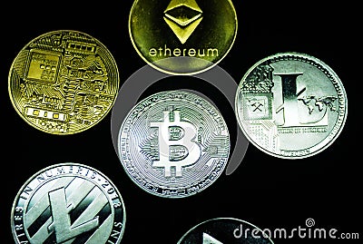 Collection of silver and gold cryptocurrency coins Editorial Stock Photo