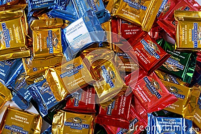 Collection of small Ghirardelli squares milk chocolate caramel candy company is a United States candy company Editorial Stock Photo