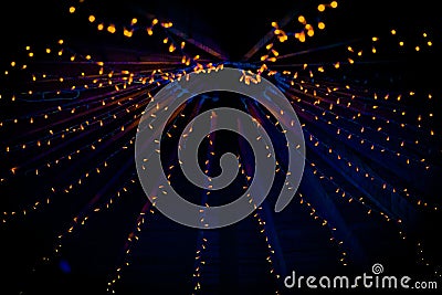 A collection of small little orange lights at a wedding Stock Photo