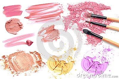 Collection of smudged lipsticks and powder cosmetic isolated on white. Stock Photo