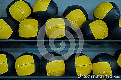 Collection of sport balls on shelves in gym Stock Photo