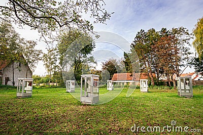 Telephone booths in a park in Damme, Belgium Editorial Stock Photo