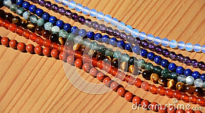 Collection of various mineral beads on thread Stock Photo