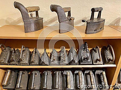 Collection of vintage cast iron irons Stock Photo