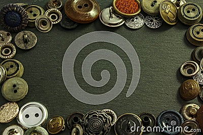 Collection of vintage clothing buttons. Dark stone background, grunge photo. Stock Photo