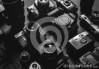 Collection Vintage Film And Digital Cameras Top View Black And White Stock Photo