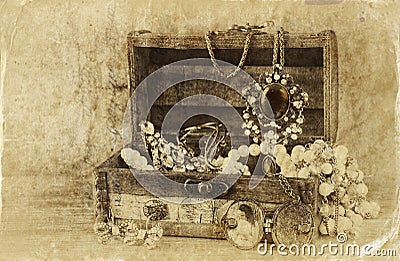 A collection of vintage jewelry in antique wooden jewelry box. retro filtered image. Old style photo. Stock Photo