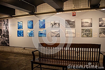 Collection of vintage photos on a tiled wall of the New York subway Editorial Stock Photo