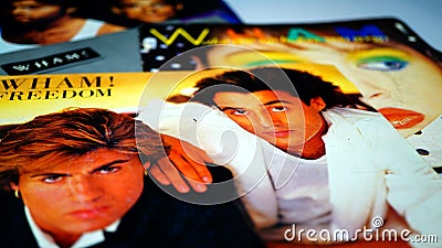 Collection of vinyl by the English duo, WHAM. first group of pop star GEORGE MICHAEL. White background Editorial Stock Photo