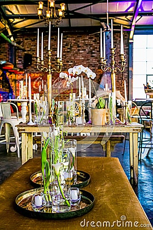 Collection of white flowers arranged on a rustic wooden table Editorial Stock Photo