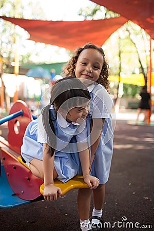 In a college in Bangkok, children have fun in the playground during the break Editorial Stock Photo