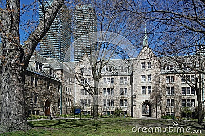 college campus with stone buildings and modern high rise apartments in background Stock Photo