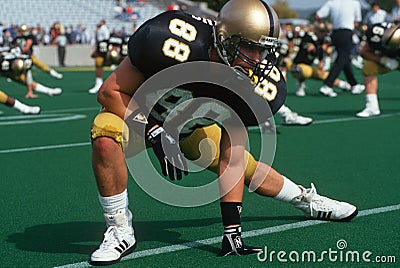 College football player stretching Editorial Stock Photo