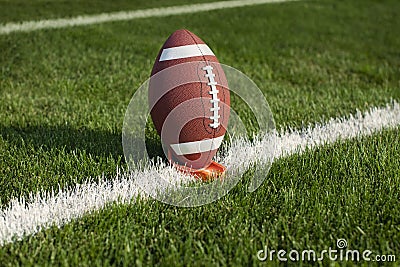 College football on a tee ready for kickoff Stock Photo