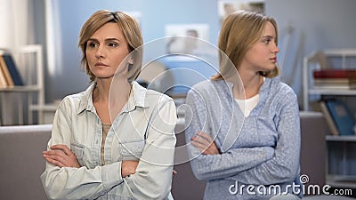 College girl conflicting with mother, mutual resentment, communication problem Stock Photo