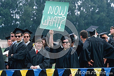 College graduates with sign, Editorial Stock Photo