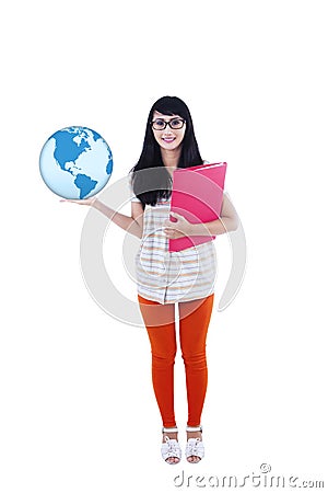 College student holding globe and folder Stock Photo