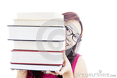 College student smiling behind books Stock Photo