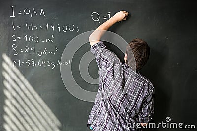 College student solving a math problem during math class Stock Photo