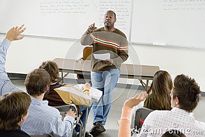 College Students And Professor In Classroom Stock Photo