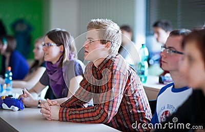 College students sitting in a classroom during class Stock Photo