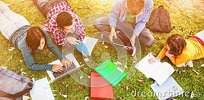 College students using laptop while doing homework Stock Photo