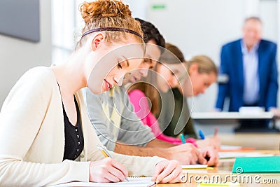 College students writing test or exam Stock Photo
