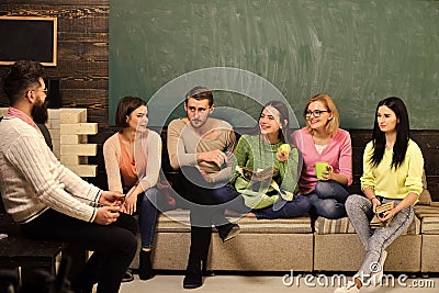 College and university concept. Group of students, group mates listening teacher, lecturer, professor. Students Stock Photo