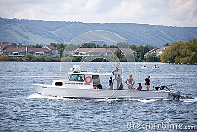 Collingwood, Ontario / Canada - August 22nd: A local Fishing Charter boat returns to the Collingwood harbour with a group of touri Editorial Stock Photo