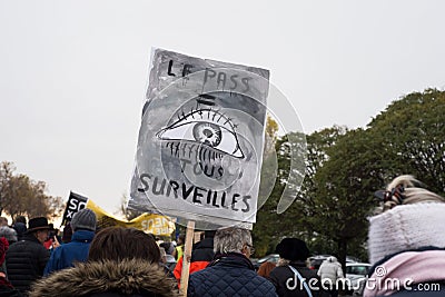 People protesting against the sanitary pass with banner in french : Le pass tous surveilles, in english : the pass all watched Editorial Stock Photo