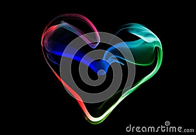 Coloful heart made of smoke, on black background Stock Photo