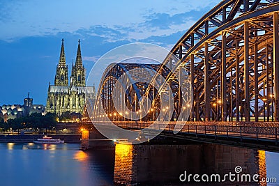 Cologne Cathedral and Hohenzollern Bridge at sunset Editorial Stock Photo