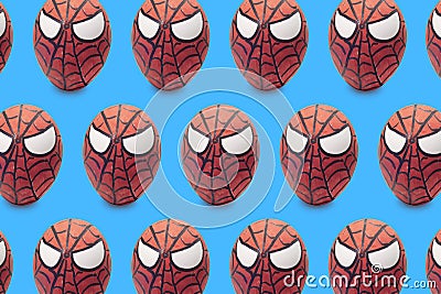 Cologne, Germany - April 13, 2020: Colorful painted spiderman Easter egg pattern in blue isolated background Editorial Stock Photo