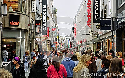 Diverse crowd fills the main shopping district street in Cologne, Germany Editorial Stock Photo